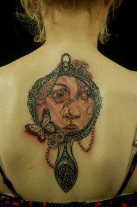 Girl face in Mirror Back Piece Tattoo