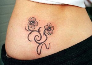 Cute Lower Back Tattoo:  Cool Flowers