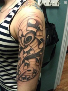 Music Notes Arm Tattoo