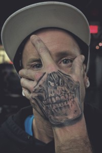 Hand Over Face Skull Tattoo