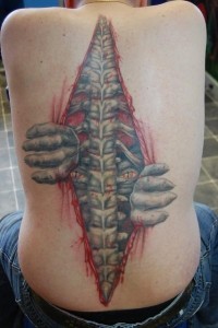 Creepy monster crawling out of back 3d tattoo